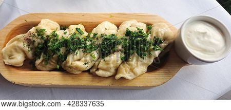 Dumplings With Lamb Meat, Green Dill And Sour Cream. Varenyky, Vareniki, Pierogi, Pyrohy.