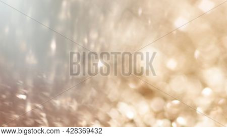 Blurry golden glitter background texture