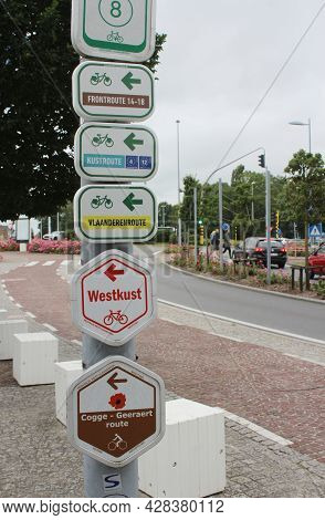 Nieuwpoort, Belgium, 15 July 2021: Signpost With Directional Information For A Number Of Different C