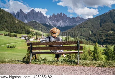 Backpacker Woman With Backpack And Trekking Poles Enjoying The Turquoise Lago Di Sorapiss 1925m Alti