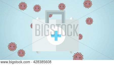 Composition of first-aid kit over covid 19 virus cells on blue background. global covid 19 pandemic concept digitally generated image.