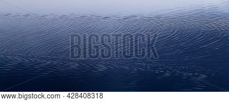 Hypnotic Geometric Ripples In Calm Crystal Waters