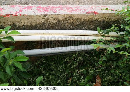 White And Gray Pipe By The Roadside Photo