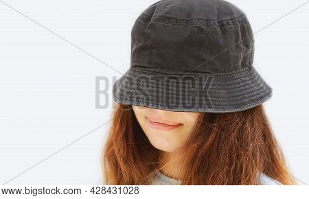 A Fashionable Girl In A Gray Panama Hat On A White Background, With Copy Space The Text. A Young, Ch