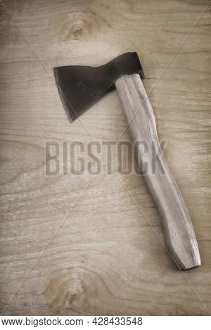 An Axe With A Wooden Axe Handle