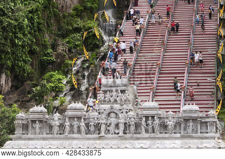 August, 21, 2017.  Gombak, Malaysia. People Walking Up And Down Steps Near A Stone Gate Cover In Hin