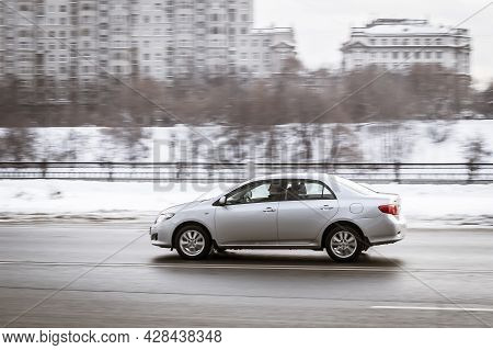 Moscow, Russia - January 2021: Silver Bright Toyota Corolla E140 Driving Outside On A Winter Street