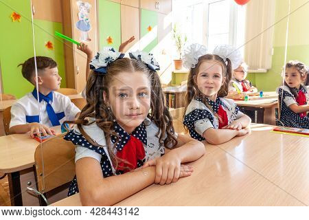 Krasnodar, Russia - September 1, 2020: First-form Schoolchildren In Classroom At School Desks On Hol