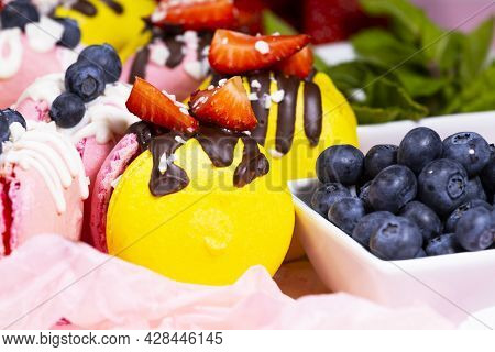 Macaroon, Handmade Beautiful Sweet Food, Dessert With Fresh Strawberries And Blueberries Decorated W