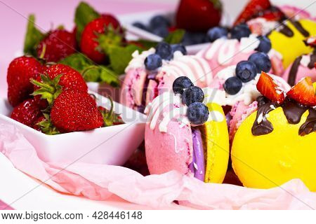 Macaroon, Handmade Beautiful Sweet Food, Dessert With Fresh Strawberries And Blueberries Decorated W