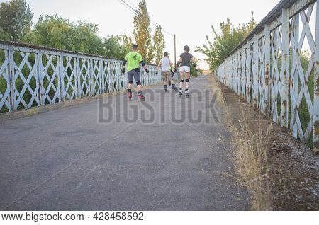 Badajoz, Spain - July 7th, 2018: Rollers Crossing Gevora Iron Bridge, Badajoz, Spain. Motion Blurred