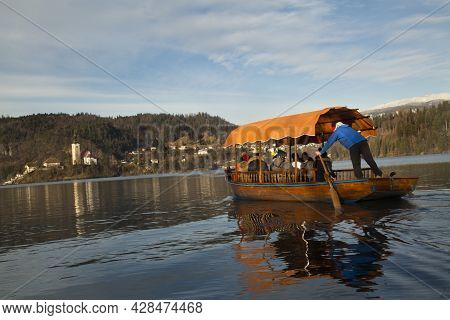 Slovenia, 30 December 2018. Traditional Pletna Boats On Lake Bled (blejsko Jezero).