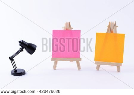 Two Wooden Easels Miniature With Blank Colored Square Canvas Or Memo Paper - Mockup. Mini Wooden Sta