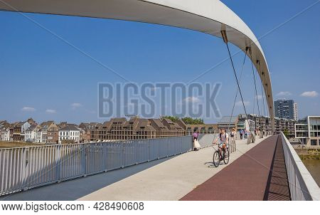 Maastricht, Netherlands - July 20, 2021: Cyclist And Pedestrians On The New Hoge Brug Bridge In Maas
