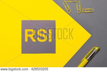 On A Gray And Yellow Background, A Gray Sticker With Yellow Text Rsi Relative Strength Index, Yellow