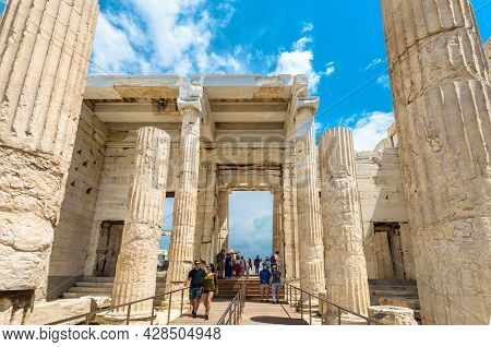 Athens - May 8, 2018: People Visit Ancient Greek Propylaea On Famous Acropolis Of Athens, Greece. Ac