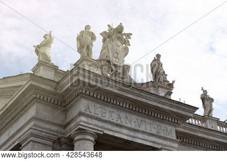 Details Of The Entablature With Statues Of Religious Saints On The Colonnades Of St. Peter's Basilic