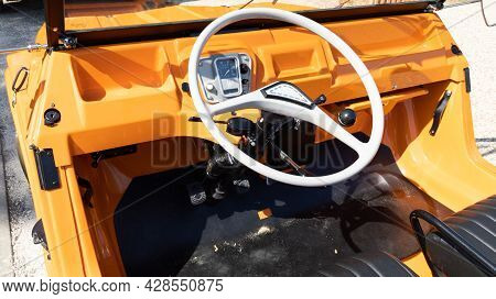 Bordeaux , Aquitaine France - 07 25 2021 : Citroen Mehari Interior Of Beach Car Orange With Steering