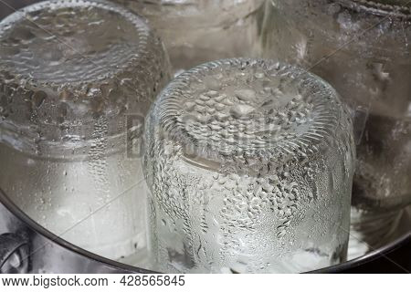 Glass Jars In The Stainless Steel Pot During Steam Sterilization For The Home Canning, Fragment Clos