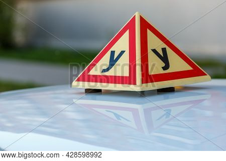 Standard Triangle Piramid Sign Of A Russian Driving School On Top Of The Vehicle.