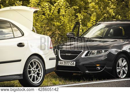 Chernigov, Ukraine - July 24, 2021: Saab Cars On The Road. Gray Saab 9-5 2010 And White Saab 9-3 On 