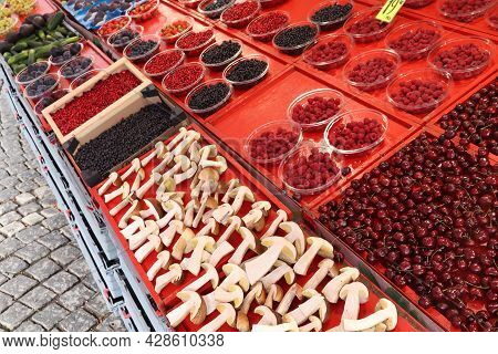 Food Market Of Hotorget In Stockholm, Sweden. Bolete Mushrooms From The Forest, Wild Berries, Lingon