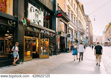 Helsinki, Finland - July 28, 2014: View Of Kluuvikatu Street. People Walk Down Street On A Summer Ev