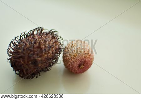 Ripe Rambutan And Leechy Or Lychee Fruits On Wooden Table. Healthy Food, Fresh Organic Fruit.