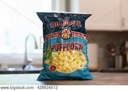 Nisswa, Mn - 2 Aug 2021: Package Of Old Dutch Puff Corn Or Puffcorn Snack, Sitting On The Kitchen Co