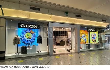 Bologna - Italy - July 2, 2021: Italian Geox Boutique Store. Geox Produces Casual Clothing And Shoes