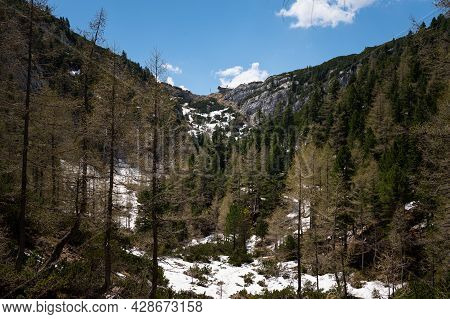 The Austrian Alps Near Admont On A Sunny Day In Early Summer, National Park Gesaeuse, Snow Patches