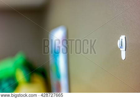 Selective Focus On Adhesive Strip Wall Hanger That Can Be Removed By Pulling Tape