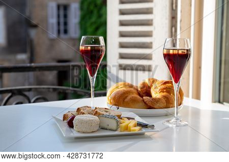 Drinking Of Kir Royal,  French Aperitif Cocktail Made  From Creme De Cassis Topped With Champagne, T