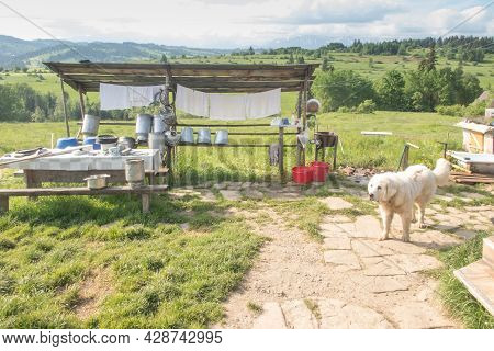Shepherd's Hut In Banska Wyzna In Podhale, Poland. Around, Various Equipment Needed To Secure The Gr