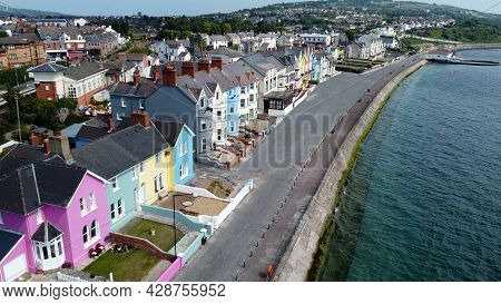Aerial Video Of Yellow Red Blue Green Orange Painted Houses By The Sea Whitehead N. Ireland