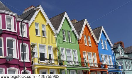 Aerial Video Of Yellow Red Blue Green Orange Painted Houses By The Sea Whitehead N. Ireland
