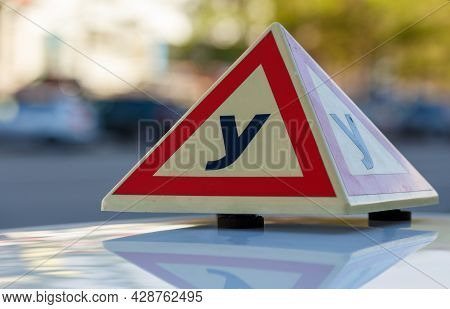 Standard Triangle Piramid Sign Of A Russian Driving School On Top Of The Vehicle.