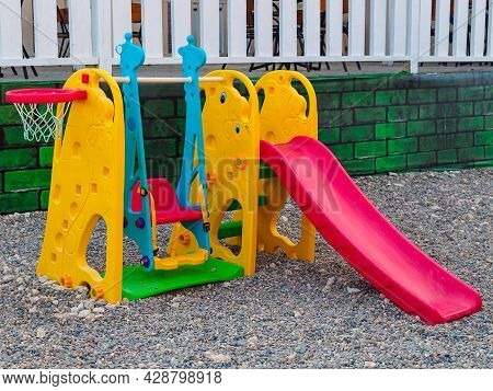 Stanitsa Blagoveshchenskaya, Krasnodar Territory, Russia - July 27, 2021: Playground With Slide, Swi