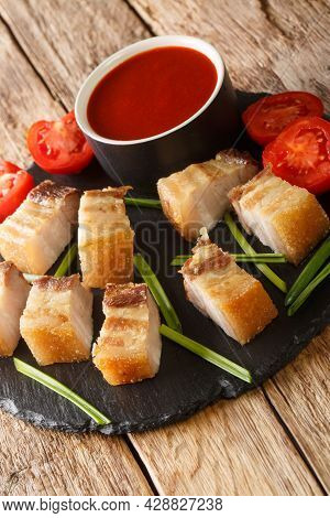 Lechon Kawali Or Crispy Deep Fried Pork Belly Served With Sweet And Sour Sauce Closeup In The Slate 