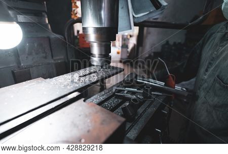 Milling Machine Working Near Worker With A Protective Mask. Tool For Cut Metal Workpiece. Vertical M
