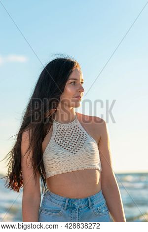 Lonely Young Woman Walking On The Beachsunset Day.beach Woman In Fashion Beachwear Relaxing Walking 