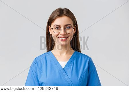 Healthcare Workers, Medicine, Insurance And Covid-19 Pandemic Concept. Cheerful Optimistic Female Nu