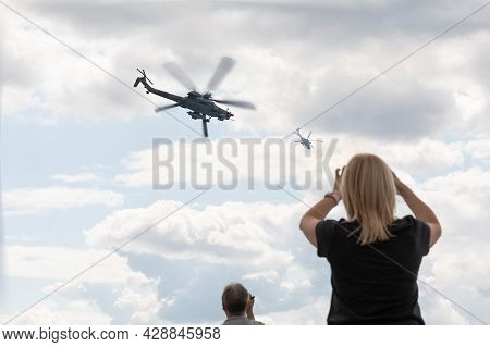 25.07.2021, Russia, Zhukovsky. Spectators At The Maks Air Show Photograph The Performance Of A Helic