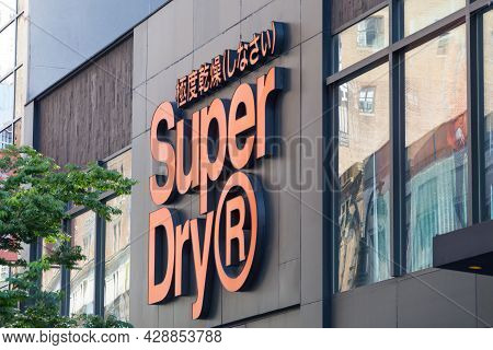 New York, Usa - May 15, 2019: The Super Dry Sign On The Exterior Of Their Clothing Store In New York