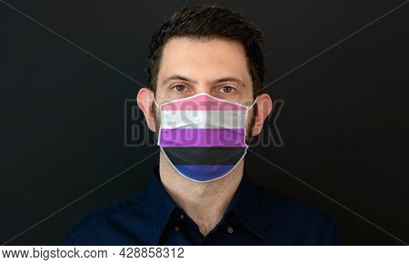 Portrait Of An Adult Man Wearing A Lgbt Genderfluid Flag Colors Facial Mask. Lgbt Gay Rights Concept
