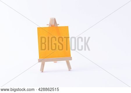 Wooden Easel Miniature With Blank Colored Square Canvas Or Memo Paper - Mockup. Mini Wooden Stand Wi