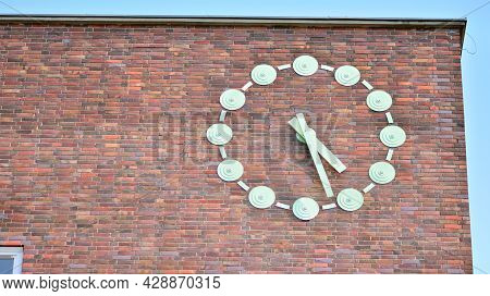 Biig Clock With Brick Building In Old City
