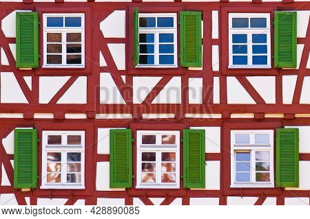 Mosbach, Germany - June 2021: Facade Of Old Historic Timber Framing Building With Red Timber Beams A