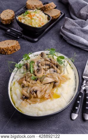 Mashed Potatoes With Butter, Fried Mushrooms With Onions And Salad Of Fresh Vegetables On A Gray Cem