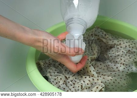 Woman Is Washing Dress From Delicate Fabric By Hands In Basin And Pouring Rinser. Laundry By Hands A